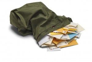 Large Green Mail Bag with Envelopes Spilling Out Isolated on White Background.